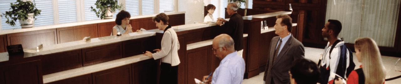 People standing in the bank line